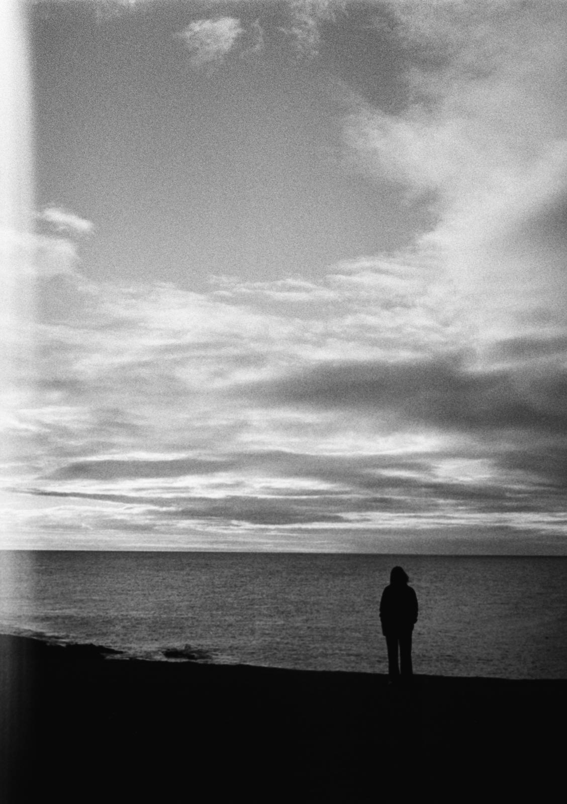 A woman by the sea.