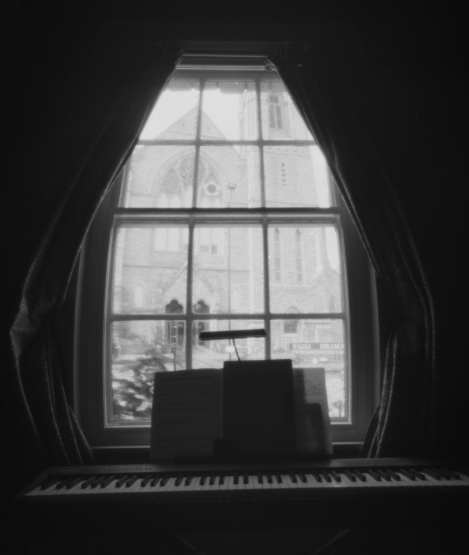 A piano in a window