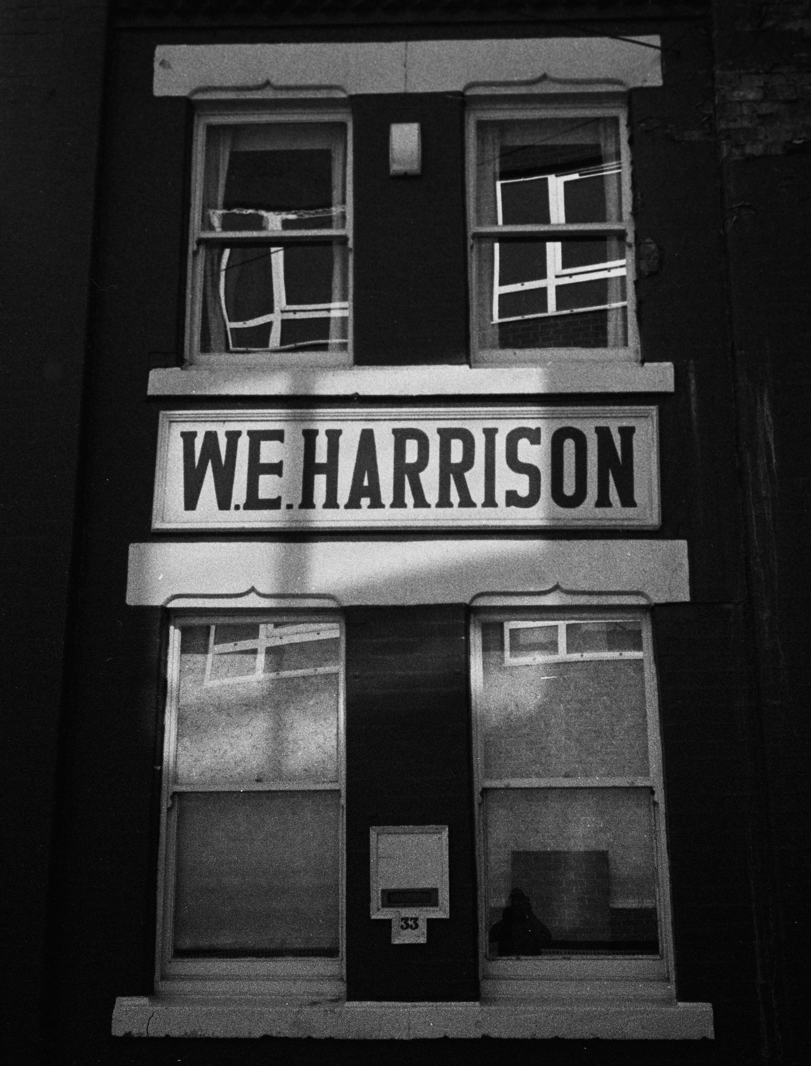 A building that says W E Harrison
