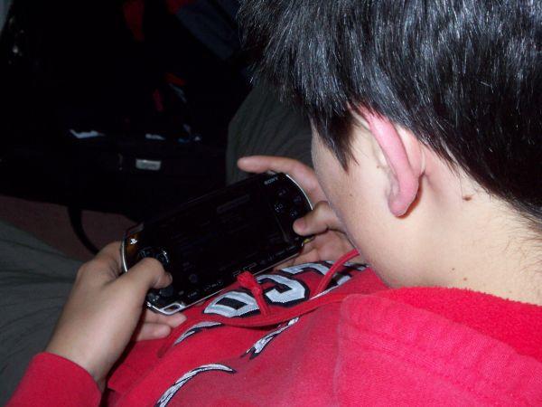 A kid on PSP