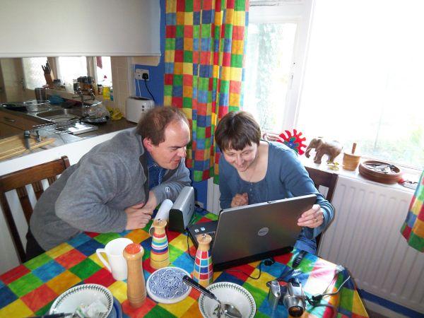 Two people looking at a computer